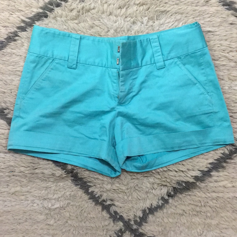 Lightly worn bright blue cuffed shorts